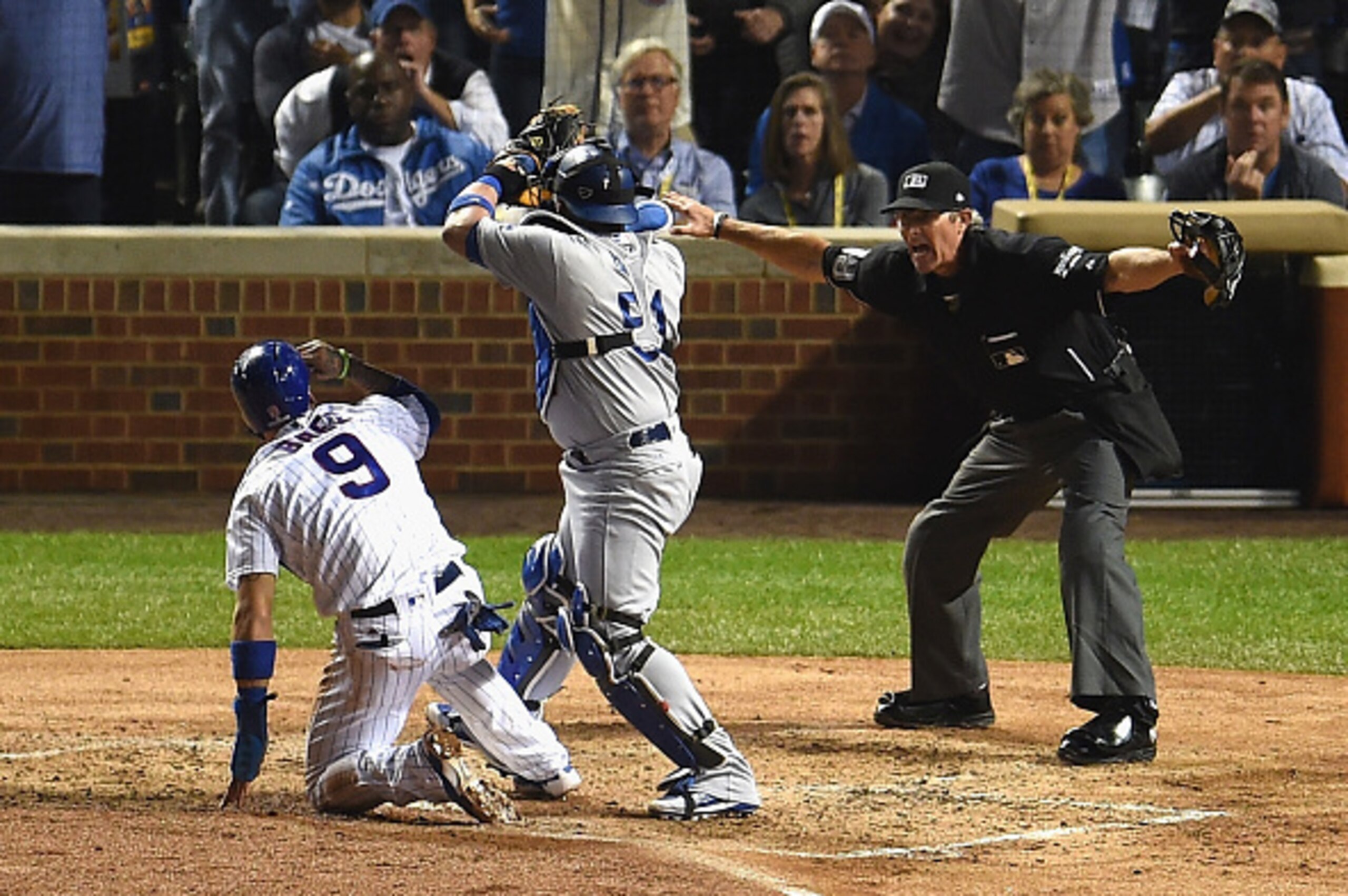 CHICAGO, IL - OCTOBER 15:  Javier Baez #9 of the Chicago Cubs steals home in the second inning as Carlos Ruiz #51 of the Los Angeles Dodgers is unable to make the tag during game one of the National League Championship Series at Wrigley Field on October 1
