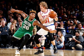 NEW YORK, NY - OCTOBER 15: Ron Baker #31 of the New York Knicks handles the ball against Marcus Smart #36 of the Boston Celtics on October 15, 2016 at Madison Square Garden in New York City, New York.  NOTE TO USER: User expressly acknowledges and agrees 