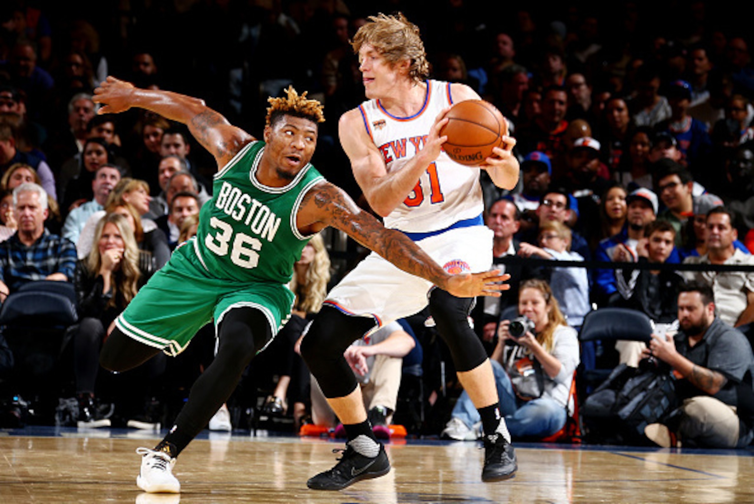 NEW YORK, NY - OCTOBER 15: Ron Baker #31 of the New York Knicks handles the ball against Marcus Smart #36 of the Boston Celtics on October 15, 2016 at Madison Square Garden in New York City, New York.  NOTE TO USER: User expressly acknowledges and agrees 