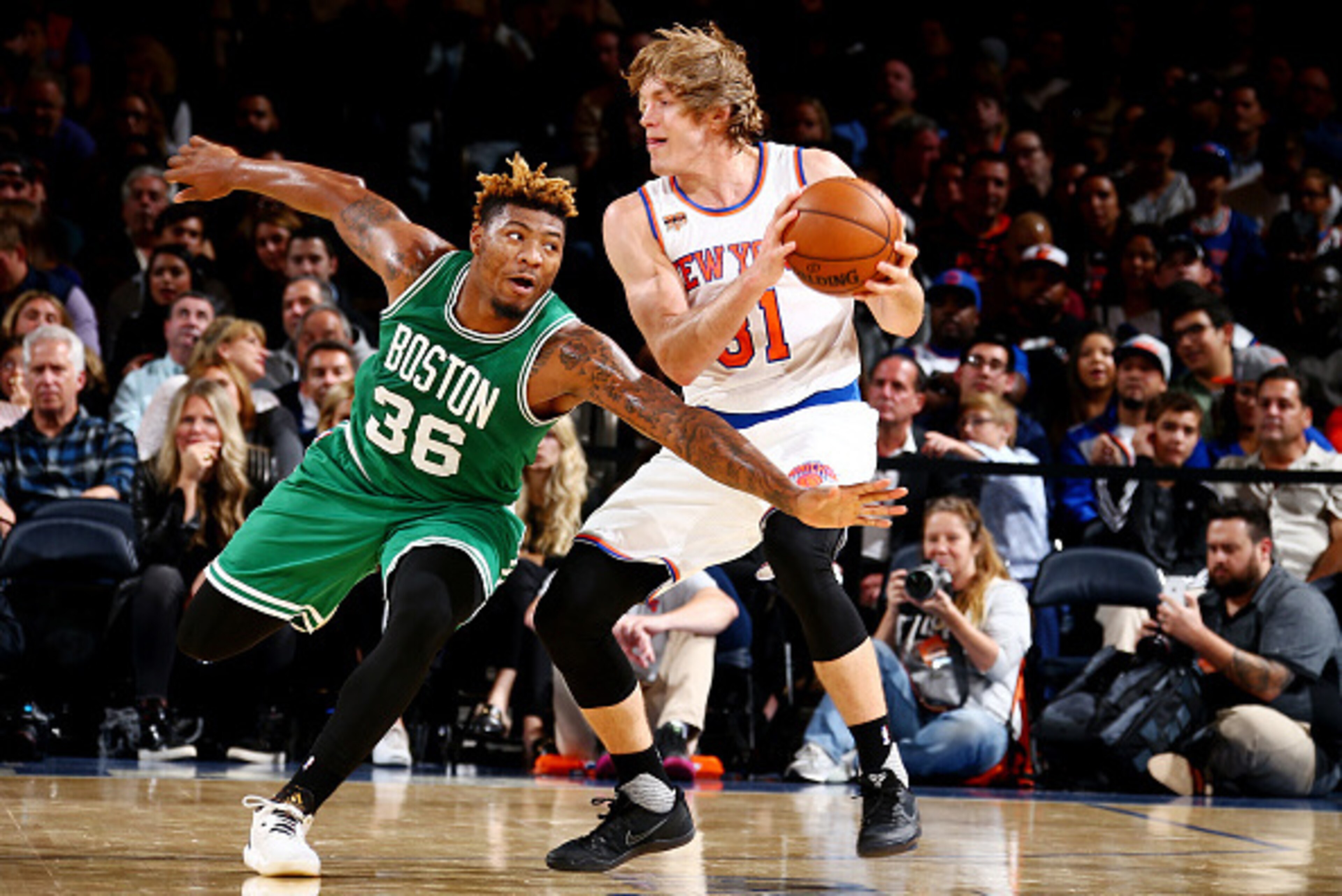 NEW YORK, NY - OCTOBER 15: Ron Baker #31 of the New York Knicks handles the ball against Marcus Smart #36 of the Boston Celtics on October 15, 2016 at Madison Square Garden in New York City, New York.  NOTE TO USER: User expressly acknowledges and agrees 