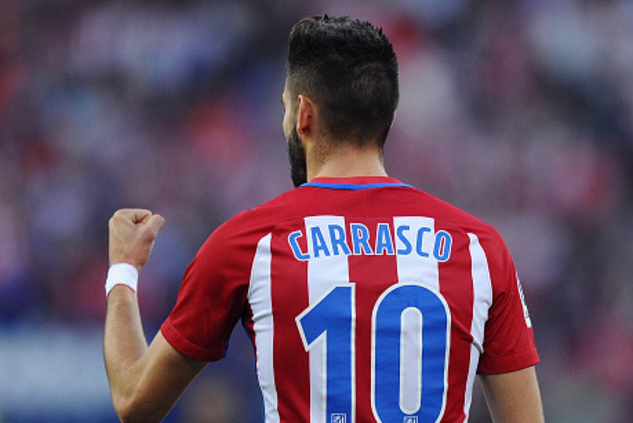 MADRID, SPAIN - OCTOBER 15:  Yannick Carrasco of Club Atletico de Madrid celebrates after scoring his team's second goal during the La Liga match between Club Atletico de Madrid and Granada CF at Vicente Calderon Stadium on October 15, 2016 in Madrid, Spa