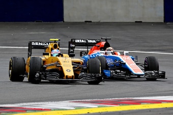 SPIELBERG, AUSTRIA - JULY 03: Jolyon Palmer of Great Britain driving the (30) Renault Sport Formula One Team Renault RS16 Renault RE16 turbo leads Pascal Wehrlein of Germany driving the (94) Manor Racing MRT-Mercedes MRT05 Mercedes PU106C Hybrid turbo on SPIELBERG, AUSTRIA - JULY 03: Jolyon Palmer of Great Britain driving the (30) Renault Sport Formula One Team Renault RS16 Renault RE16 turbo leads Pascal Wehrlein of Germany driving the (94) Manor Racing MRT-Mercedes MRT05 Mercedes PU106C Hybrid turbo on
