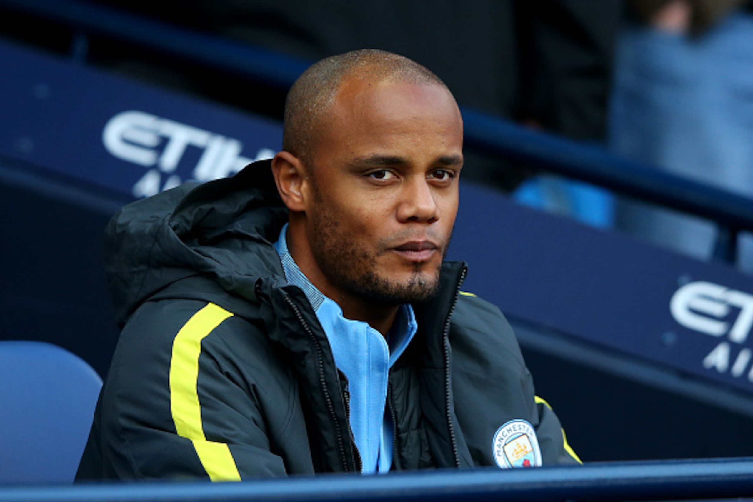 MANCHESTER, ENGLAND - OCTOBER 15: Vincent Kompany of Manchester City takes his seat on the bench during the Premier League match between Manchester City and Everton at Etihad Stadium on October 15, 2016 in Manchester, England.  (Photo by Alex Livesey/Gett