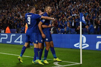 LEICESTER, ENGLAND - SEPTEMBER 27:  Islam Slimani of Leicester City (R) celebrates with team mates as he scores their first goal during the UEFA Champions League Group G match between Leicester City FC and FC Porto at The King Power Stadium on September 2