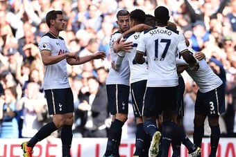 Tottenham's players celebrate taking the lead after Manchester City's Serbian defender Aleksandar Kolarov's own goal during the English Premier League football match between Tottenham Hotspur and Manchester City at White Hart Lane in London, on October 2,