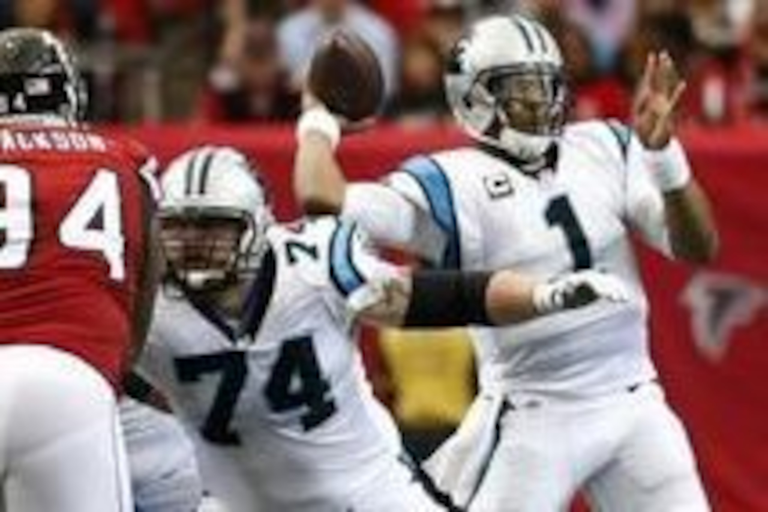 Oct 2, 2016; Atlanta, GA, USA; Carolina Panthers quarterback Cam Newton (1) attempts a pass as tackle Mike Remmers (74) blocks Atlanta Falcons defensive end Tyson Jackson (94) in the first quarter of their game at the Georgia Dome. Mandatory Credit: Jason