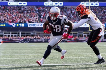 FOXBORO, MA - OCTOBER 16:  James White #28 of the New England Patriots runs in a touchdown against the Cincinnati Bengals in the third quater of the game at Gillette Stadium on October 16, 2016 in Foxboro, Massachusetts.  (Photo by Jim Rogash/Getty Images