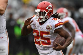 OAKLAND, CA - OCTOBER 16:  Jamaal Charles #25 of the Kansas City Chiefs rushes for a four-yard touchdown against the Oakland Raiders during their NFL game at Oakland-Alameda County Coliseum on October 16, 2016 in Oakland, California.  (Photo by Thearon W.