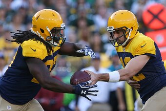 GREEN BAY, WI - OCTOBER 16: Eddie Lacy #27 takes the handoff from Aaron Rodgers #12 of the Green Bay Packers against the Dallas Cowboys during the first quarter at Lambeau Field on October 16, 2016 in Green Bay, Wisconsin.  (Photo by Dylan Buell/Getty Ima