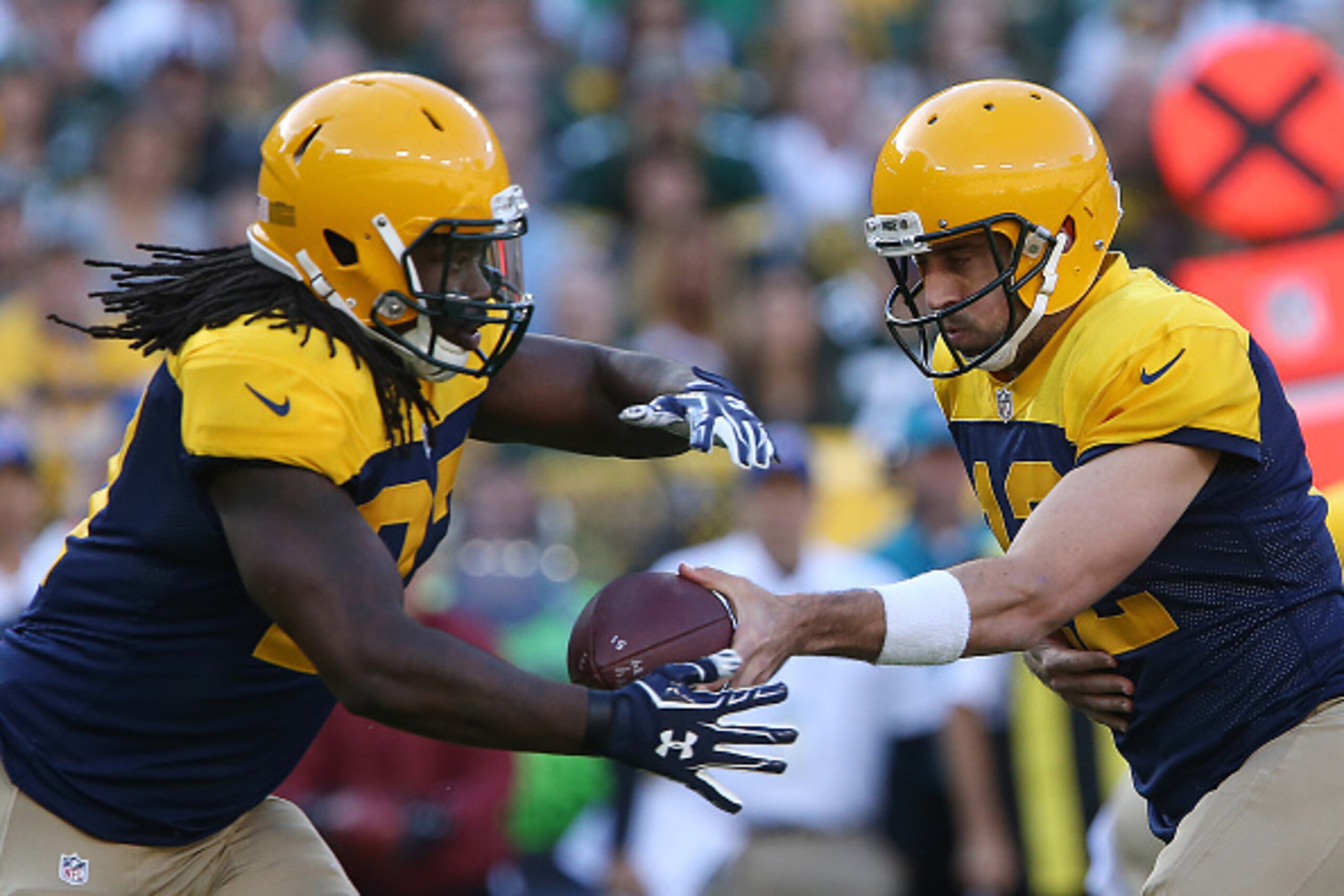 GREEN BAY, WI - OCTOBER 16: Eddie Lacy #27 takes the handoff from Aaron Rodgers #12 of the Green Bay Packers against the Dallas Cowboys during the first quarter at Lambeau Field on October 16, 2016 in Green Bay, Wisconsin.  (Photo by Dylan Buell/Getty Ima