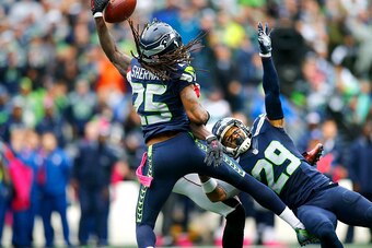 SEATTLE, WA - OCTOBER 16:  Cornerback Richard Sherman #25 of the Seattle Seahawks and teammate free safety Earl Thomas #29 team up to block a pass intended for Wide receiver Julio Jones #11 of the Atlanta Falcons at CenturyLink Field on October 16, 2016 i