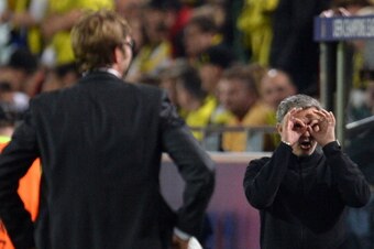 A:TERNATIVE CROP - Dortmund's head coach Juergen Klopp (L) looks on as Real Madrid's Portuguese coach Jose Mourinho (R) gestures during the UEFA Champions League semi final first leg football match between Borussia Dortmund and Real Madrid on April 24, 20