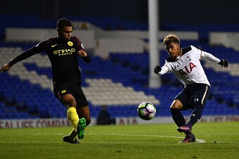LONDON, ENGLAND - OCTOBER 14:   Marcus Edwards of Tottenham Hotspur takes a shot at goal under pressure from Cameron Humphreys of Manchester City during the Premier League 2 match between Tottenham Hotspur and Manchester City at White Hart Lane on October
