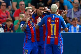 LEGANES, SPAIN - SEPTEMBER 17: Lionel Messi (L) celebrates scoring their opening goal with teammate Luis Suarez (2ndL) and Neymar JR. (R) during the La Liga match between Deportivo Leganes and FC Barcelona at Estadio Municipal de Butarque on September 17,