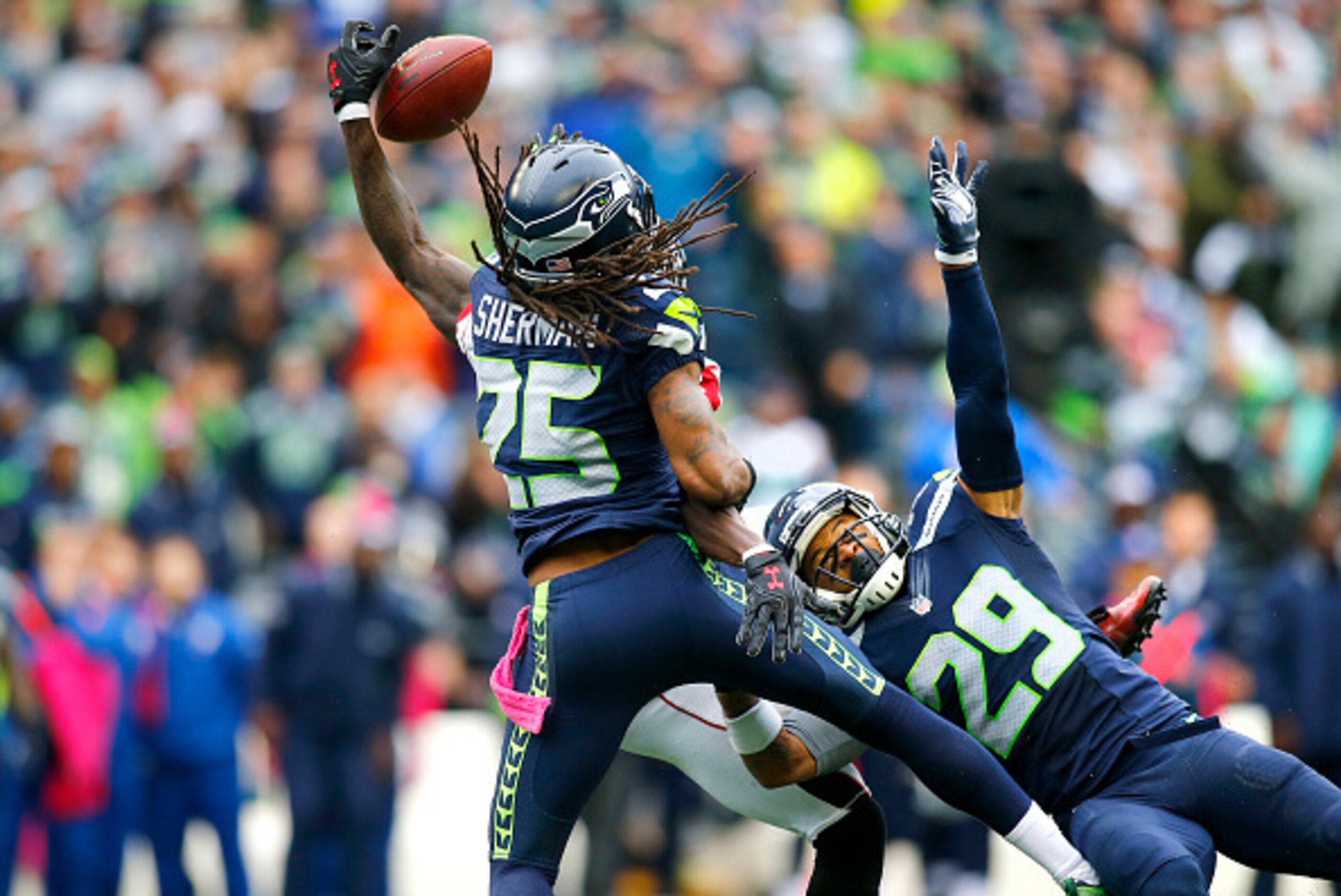 SEATTLE, WA - OCTOBER 16:  Cornerback Richard Sherman #25 of the Seattle Seahawks and teammate free safety Earl Thomas #29 team up to block a pass intended for Wide receiver Julio Jones #11 of the Atlanta Falcons at CenturyLink Field on October 16, 2016 i