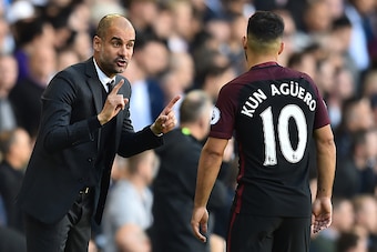 Manchester City's Spanish manager Pep Guardiola (L) gestures to Manchester City's Argentinian striker Sergio Aguero during the English Premier League football match between Tottenham Hotspur and Manchester City at White Hart Lane in London, on October 2, 