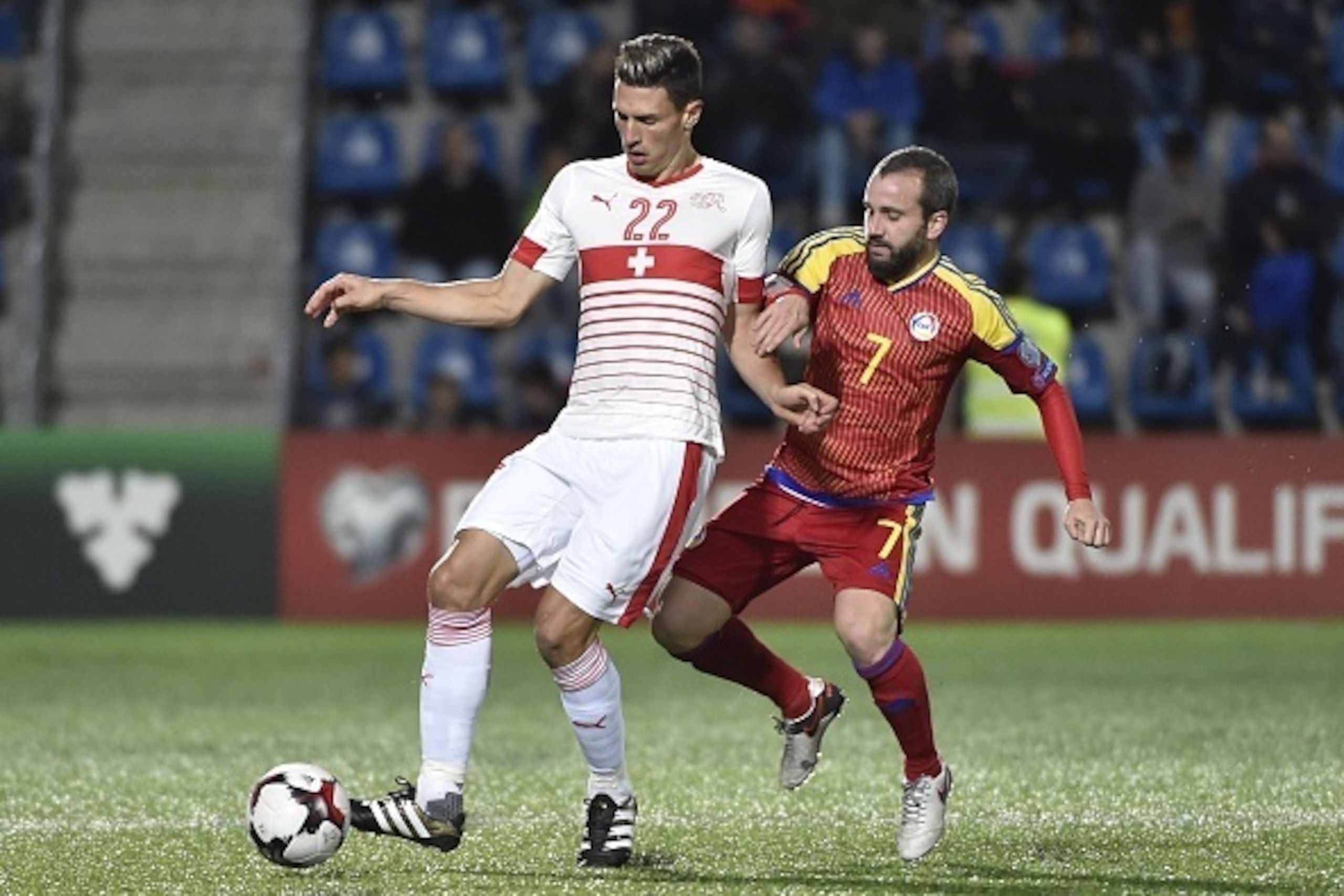 Andorra's defender Marc Pujol vies with Switzerland's defender Fabian Schar during the FIFA World Cup 2018 football qualifier between Andorra and Switzerland on at the Municipal Stadium in Andorra la Vella October 10, 2016. / AFP / PASCAL PAVANI        (P