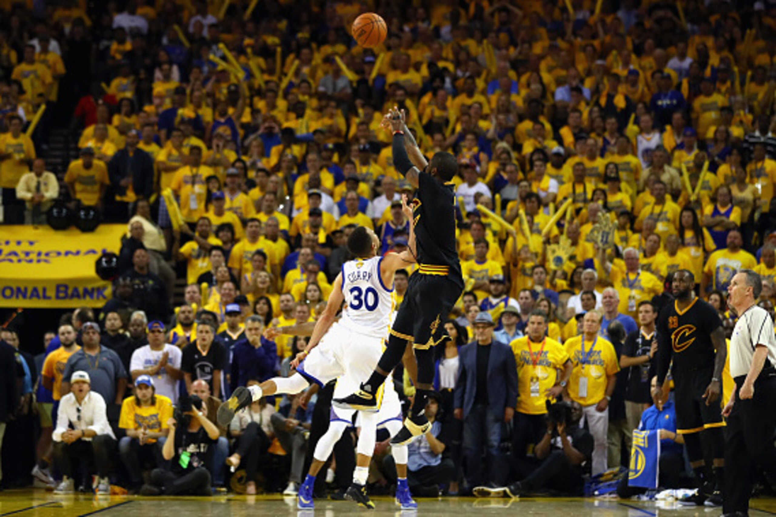 OAKLAND, CA - JUNE 19:  Kyrie Irving #2 of the Cleveland Cavaliers shoots a three-point basket late in the fourth quarter against Stephen Curry #30 of the Golden State Warriors in Game 7 of the 2016 NBA Finals at ORACLE Arena on June 19, 2016 in Oakland, 