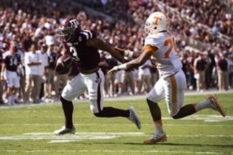 Oct 8, 2016; College Station, TX, USA; Texas A&M Aggies wide receiver Christian Kirk (3) stiff arms Tennessee Volunteers defensive back Evan Berry (29) and scores a touchdown during the first quarter at Kyle Field. Mandatory Credit: Jerome Miron-USA TODAY