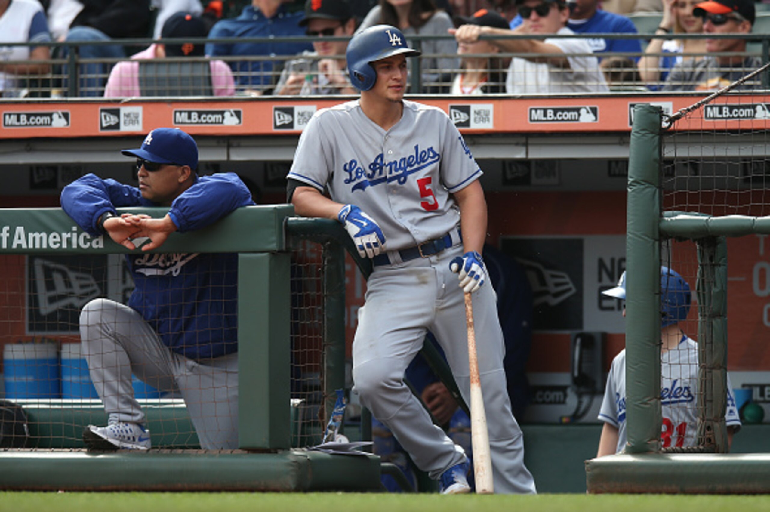 SAN FRANCISCO, CA - OCTOBER 2:  Corey Seager #5 of the Los Angeles Dodgers waits in the dugout for his next at bat alongside his manager Dave Roberts #30 during the game against the San Francisco Giants at AT&T Park on Sunday, October 2, 2016 in San Franc