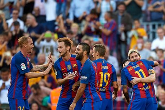 BARCELONA, SPAIN - OCTOBER 15:   Lionel Messi (R) of FC Barcelona celebrates with his teammates after scoring his team's fourth goal during the La Liga match between FC Barcelona and RC Deportivo de La Coruna at Camp Nou stadium on October 15, 2016 in Bar