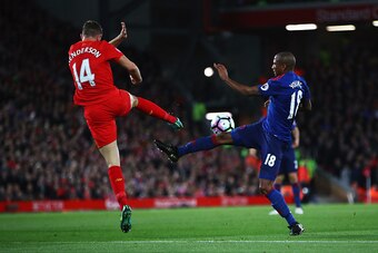 LIVERPOOL, ENGLAND - OCTOBER 17: Ashley Young of Manchester United is tackled by Jordan Henderson of Liverpool during the Premier League match between Liverpool and Manchester United at Anfield on October 17, 2016 in Liverpool, England.  (Photo by Clive B