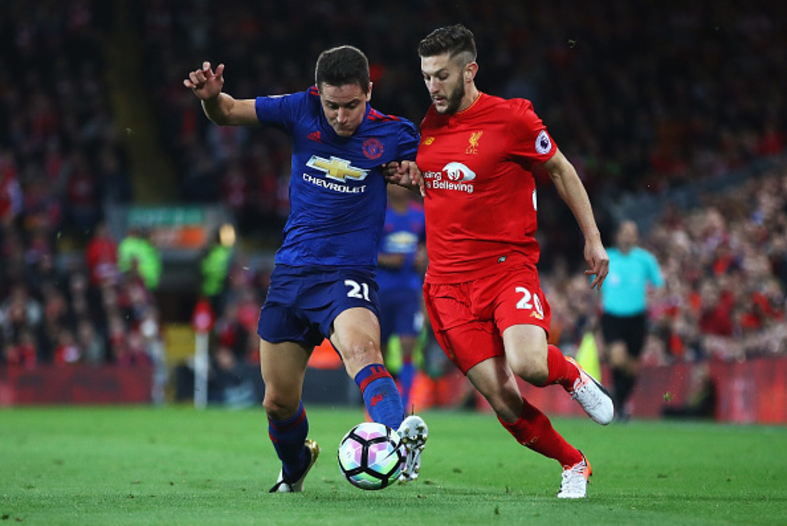 LIVERPOOL, ENGLAND - OCTOBER 17: Ander Herrera of Manchester United takes on Adam Lallana of Liverpool during the Premier League match between Liverpool and Manchester United at Anfield on October 17, 2016 in Liverpool, England.  (Photo by Clive Brunskill