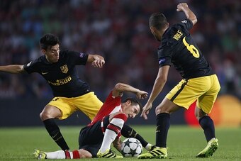 (L-R), Nicolas Gaitan of Club Atletico de Madrid, Andres Guardado of PSV, Koke of Club Atletico de Madrid during the UEFA Champions League group D match between PSV Eindhoven and Atletico Madrid on September 13, 2016 at the Philips stadium in Eindhoven, T
