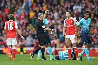 LONDON, ENGLAND - OCTOBER 15:  Referee Jonanthan Moss (L) shows Granit Xhaka of Arsenal (R) a red card during the Premier League match between Arsenal and Swansea City at Emirates Stadium on October 15, 2016 in London, England.  (Photo by Mike Hewitt/Gett