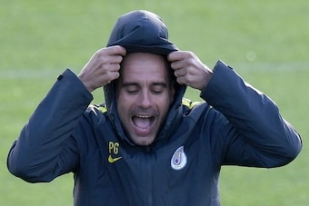 Manchester City's Spanish manager Pep Guardiola attends a team training session at Manchester City Football Academy Campus in Manchester, north west England, on October 18, 2016 ahead of their UEFA Champions League Group C football match against Barcelona