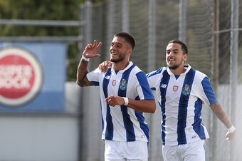 OLIVAL, PORTUGAL - SEPTEMBER 14: FC Porto's forward Rui Pedro celebrates scoring Porto's third goal with FC Porto's forward Bruno Costa during the UEFA Youth Champions League match between FC Porto and FC Copenhagen at Centro de Estagio do Olival on Septe