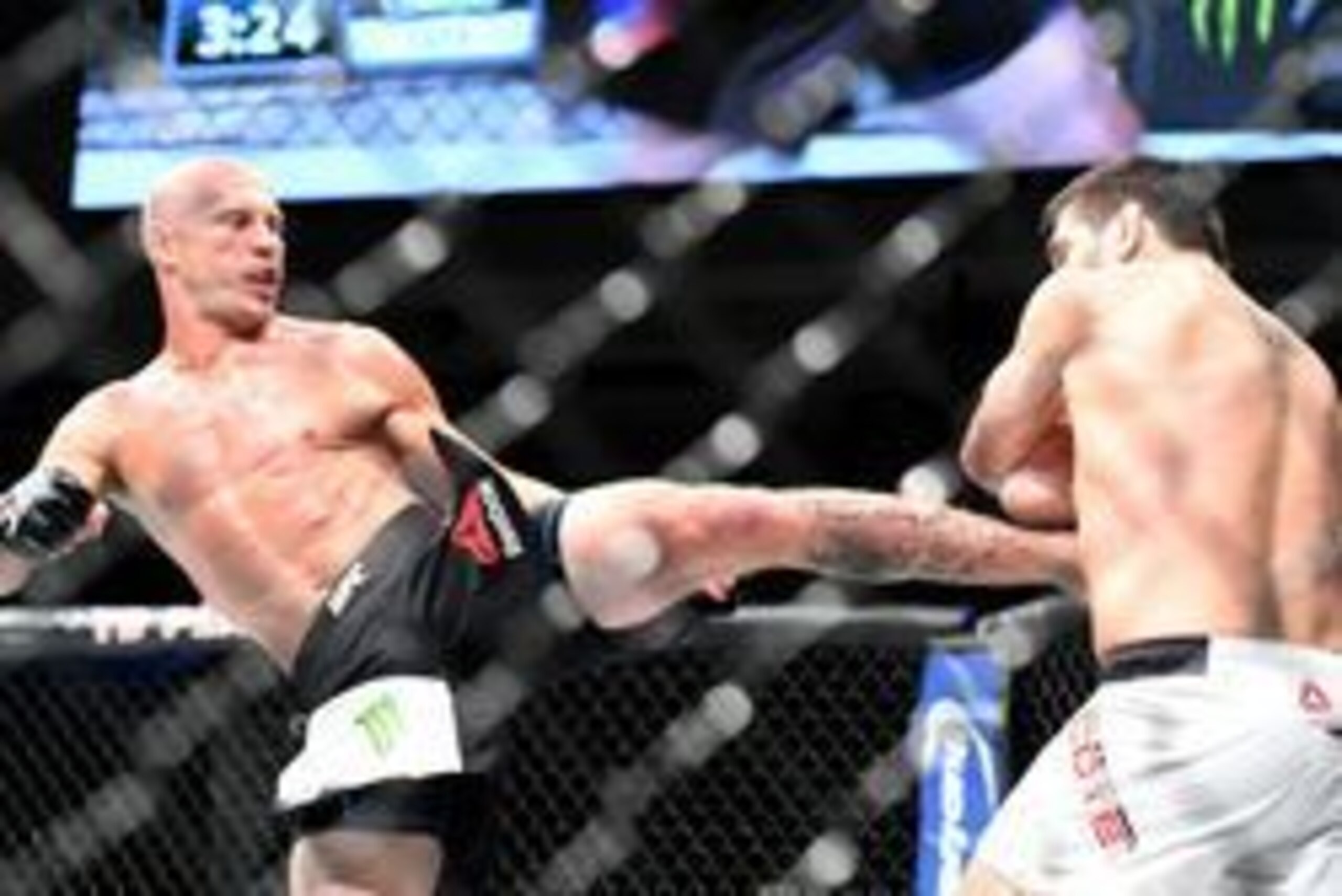 Jun 18, 2016; Ottawa, Ontario, Canada; Patrick Cote (blue gloves) fights Donald Cerrone (red gloves) in a welterweight bout during UFC Fight Night at TD Place Arena. Mandatory Credit: Marc DesRosiers-USA TODAY Sports