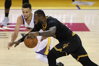 OAKLAND, CA - JUNE 19:  LeBron James #23 of the Cleveland Cavaliers drives with the ball against Stephen Curry #30 of the Golden State Warriors in Game 7 of the 2016 NBA Finals at ORACLE Arena on June 19, 2016 in Oakland, California. NOTE TO USER: User ex