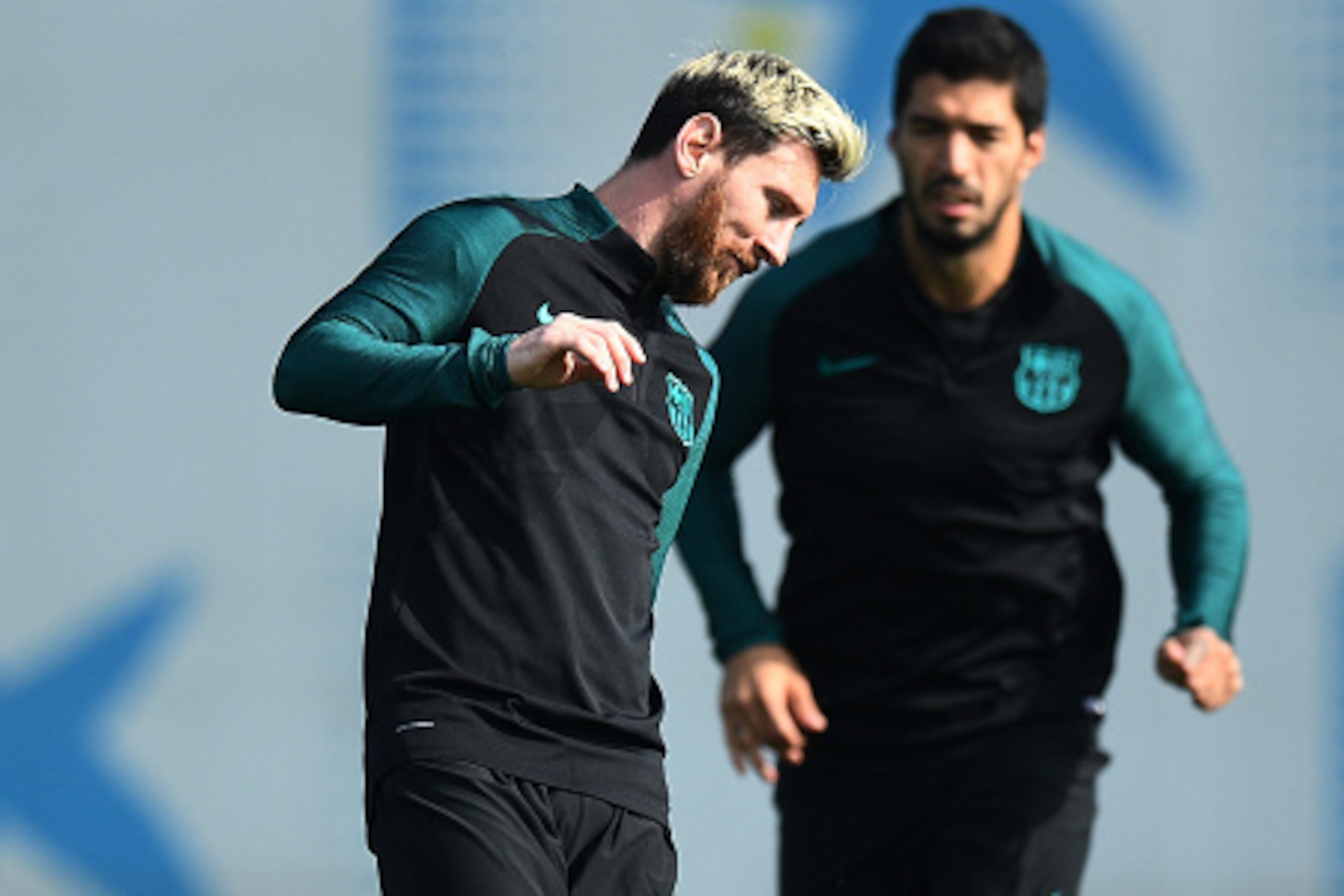 BARCELONA, SPAIN - OCTOBER 18:  Lionel Messi and Luis Suarez of Barcelona warm up during the FC Barcelona training session at Ciutat Esportiva Joan Gamper on October 18, 2016 in Barcelona, Spain.  (Photo by David Ramos/Getty Images)