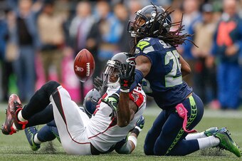 SEATTLE, WA - OCTOBER 16:  Wide receiver Julio Jones #11 of the Atlanta Falcons can't make the catch on fourth down as cornerback Richard Sherman #25 of the Seattle Seahawks defends at CenturyLink Field on October 16, 2016 in Seattle, Washington.  (Photo 