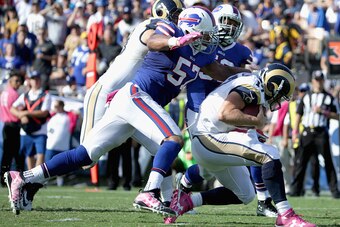 LOS ANGELES, CA - OCTOBER 09:  Quarterback Case Keenum #17 of the Los Angeles Rams is sacked by Lorenzo Alexander #57 of the Buffalo Bills during the third quarter of the game at the Los Angeles Memorial Coliseum on October 9, 2016 in Los Angeles, Califor