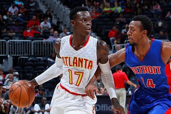 ATLANTA, GA - OCTOBER 13:  Dennis Schroder #17 of the Atlanta Hawks drives against Ish Smith #14 of the Detroit Pistons at Philips Arena on October 13, 2016 in Atlanta, Georgia.  NOTE TO USER User expressly acknowledges and agrees that, by downloading and