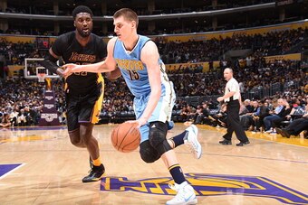LOS ANGELES, CA - MARCH 25: Nikola Jokic #15 of the Denver Nuggets handles the ball against the Los Angeles Lakers on March 25, 2016 at STAPLES Center in Los Angeles, California. NOTE TO USER: User expressly acknowledges and agrees that, by downloading an