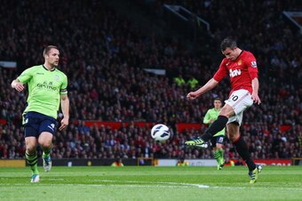 MANCHESTER, ENGLAND - APRIL 22:  Robin van Persie of Manchester United scores his team's second goal during the Barclays Premier League match between Manchester United and Aston Villa at Old Trafford on April 22, 2013 in Manchester, England.  (Photo by Al