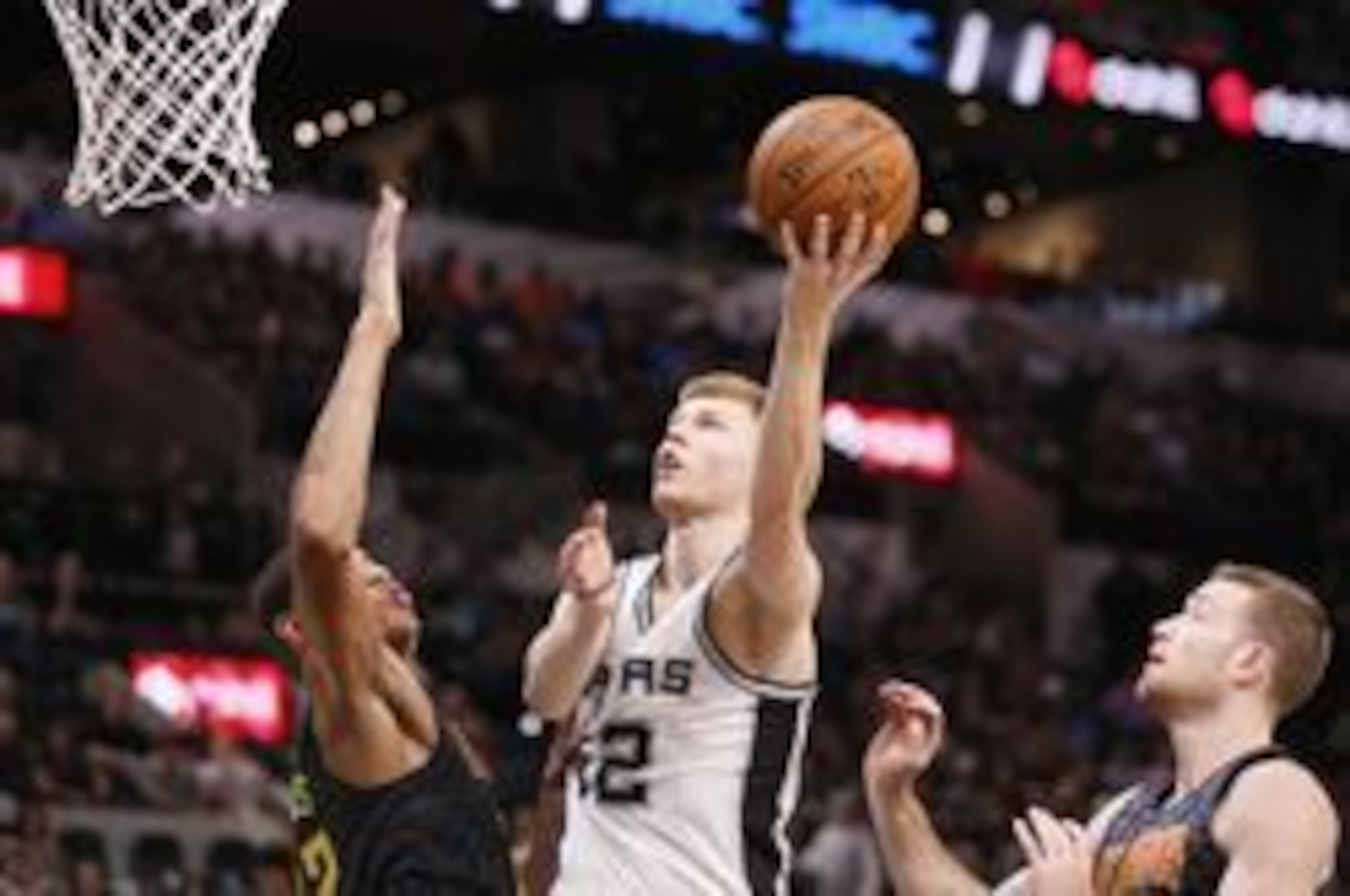 Oct 8, 2016; San Antonio, TX, USA; San Antonio Spurs small forward Davis Bertans (42) shoots the ball as Atlanta Hawks center Walter Tavares (22, left) defends during the second half at AT&T Center. Mandatory Credit: Soobum Im-USA TODAY Sports