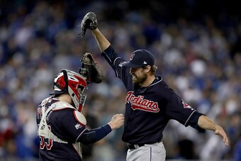 TORONTO, ON - OCTOBER 17:  Andrew Miller #24 of the Cleveland Indians celebrates with teammate Roberto Perez #55 after defeating the Toronto Blue Jays with a score of 4 to 2 in game three of the American League Championship Series at Rogers Centre on Octo