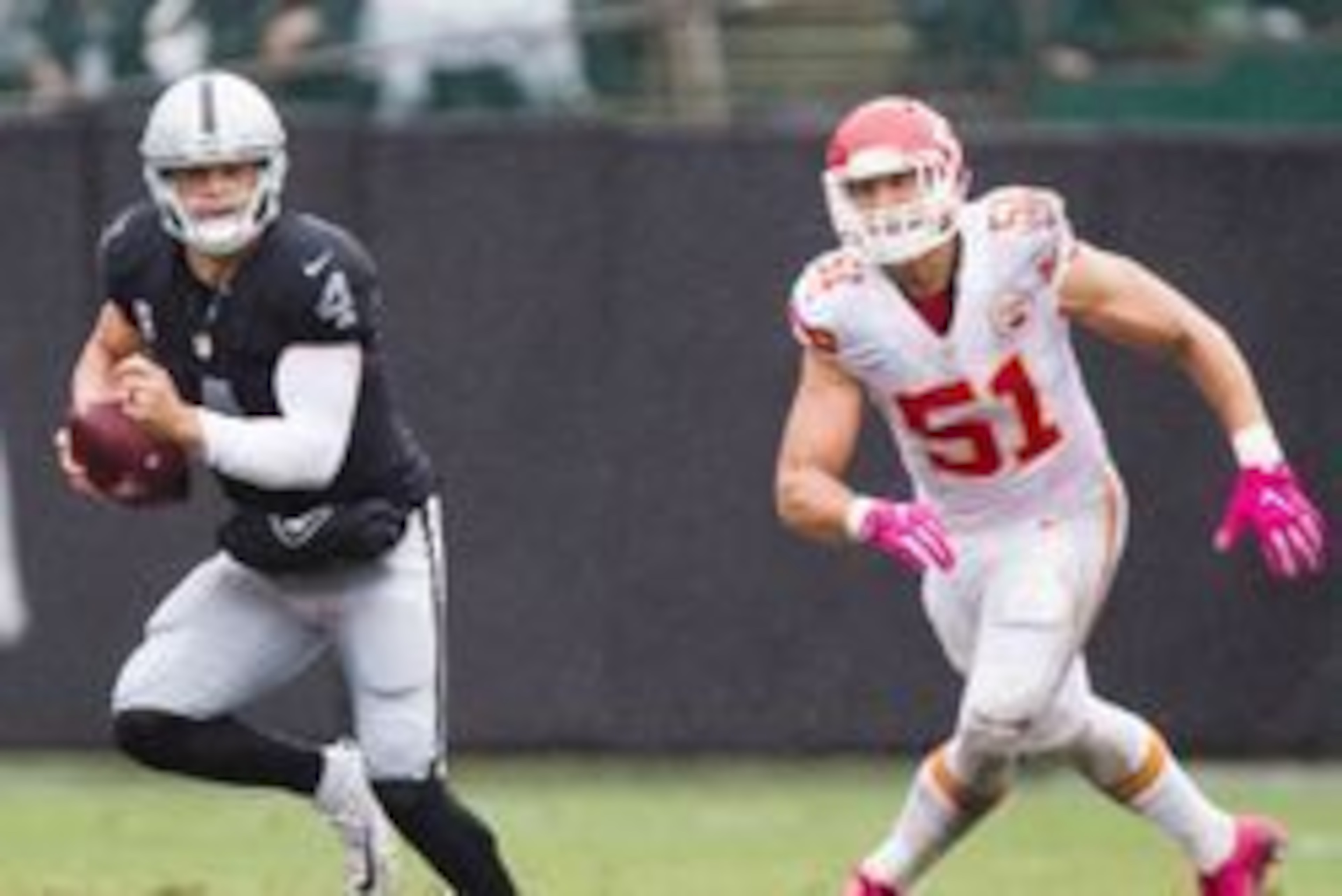 Oct 16, 2016; Oakland, CA, USA; Oakland Raiders quarterback Derek Carr (4) runs with the ball in front of Kansas City Chiefs outside linebacker Frank Zombo (51) during the second quarter at Oakland Coliseum. Mandatory Credit: Kelley L Cox-USA TODAY Sports Oct 16, 2016; Oakland, CA, USA; Oakland Raiders quarterback Derek Carr (4) runs with the ball in front of Kansas City Chiefs outside linebacker Frank Zombo (51) during the second quarter at Oakland Coliseum. Mandatory Credit: Kelley L Cox-USA TODAY Sports