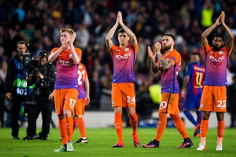 BARCELONA, SPAIN - OCTOBER 19: (L-R) Kevin De Bruyne, John Stones, Nicolas Otamendi and Gael Clichy of Manchester City FC applaud to their team's supporters at the end of the UEFA Champions League group C match between FC Barcelona and Manchester City FC 