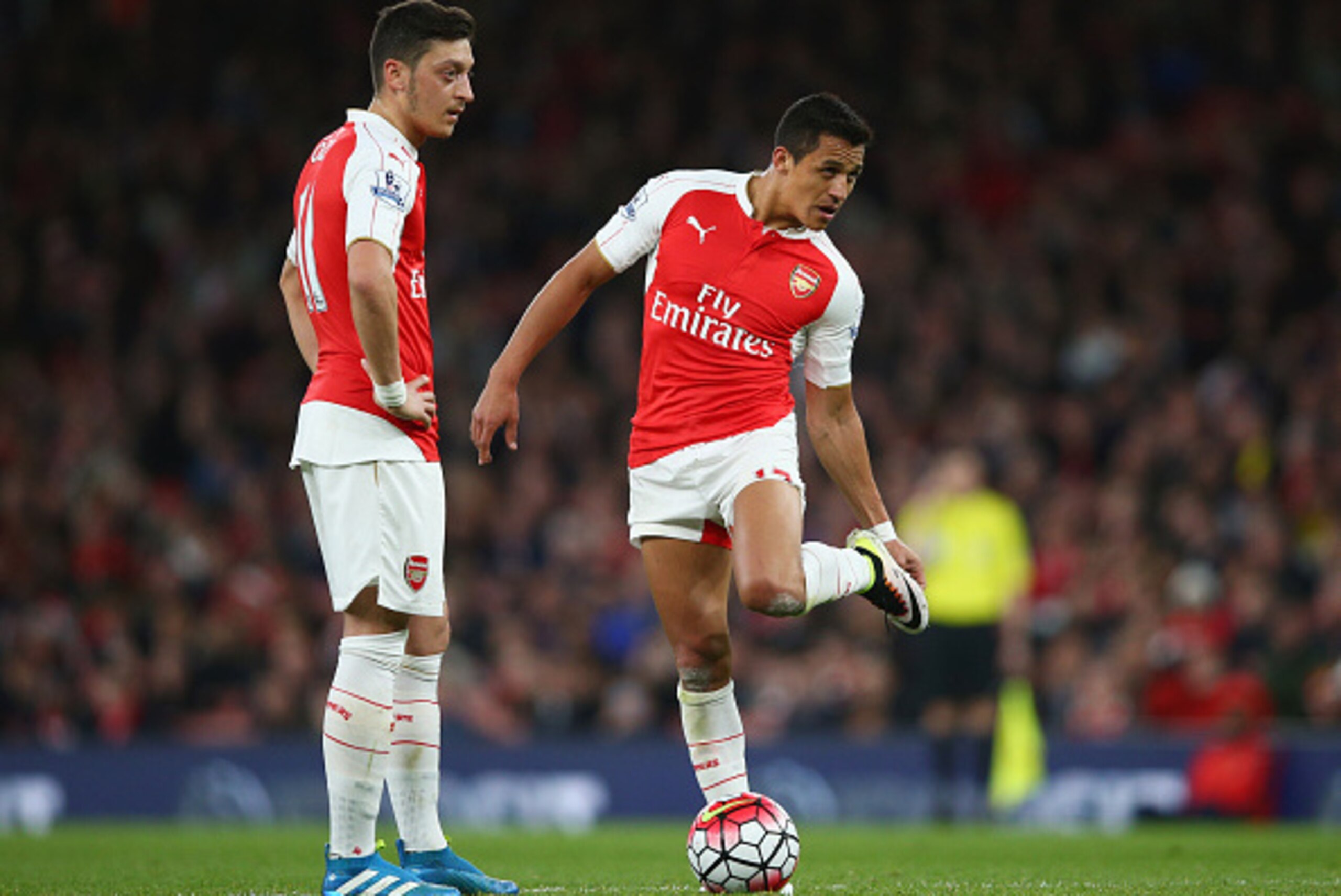 LONDON, ENGLAND - APRIL 21:  Mesut Ozil and Alexis Sanchez of Arsenal prepare to kick off during the Barclays Premier League match between Arsenal and West Bromwich Albion at the Emirates Stadium on April 21, 2016 in London, England.  (Photo by Paul Gilha