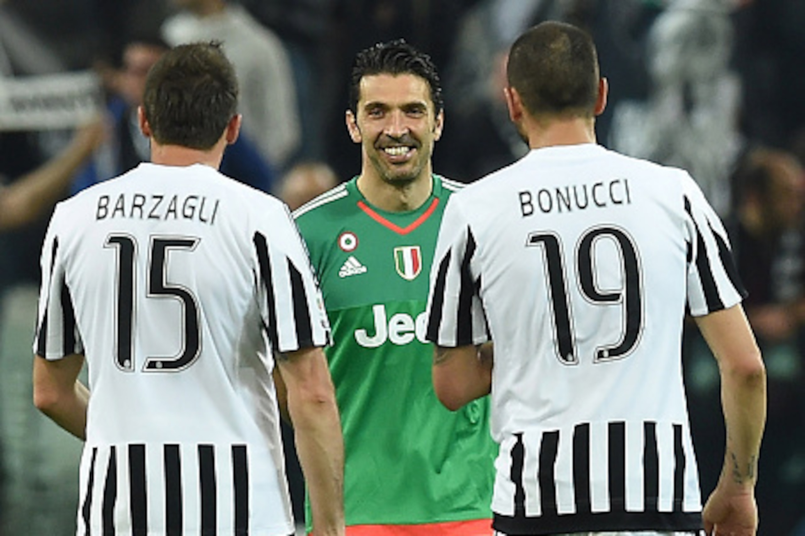 TURIN, ITALY - APRIL 20:  Gianluigi Buffon (C) of Juventus FC celebrates victory with team mates Andrea Barzagli (L) and Leonardo Bonucci at the end of the Serie A match between Juventus FC and SS Lazio at Juventus Arena on April 20, 2016 in Turin, Italy.