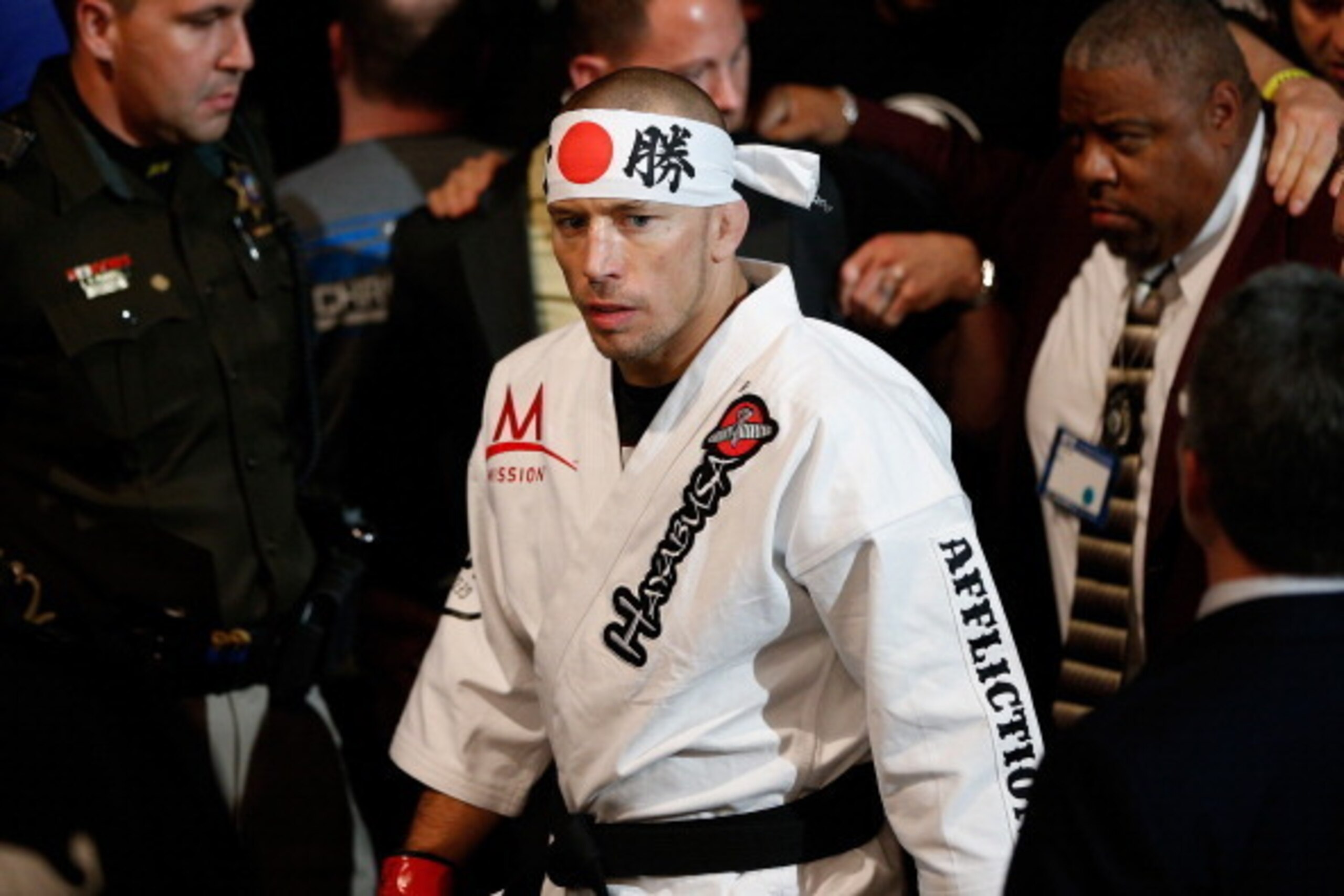 LAS VEGAS, NV - NOVEMBER 16:  Georges St-Pierre walks to the Octagon to face Johny Hendricks in their UFC welterweight championship bout during the UFC 167 event inside the MGM Grand Garden Arena on November 16, 2013 in Las Vegas, Nevada. (Photo by Josh H