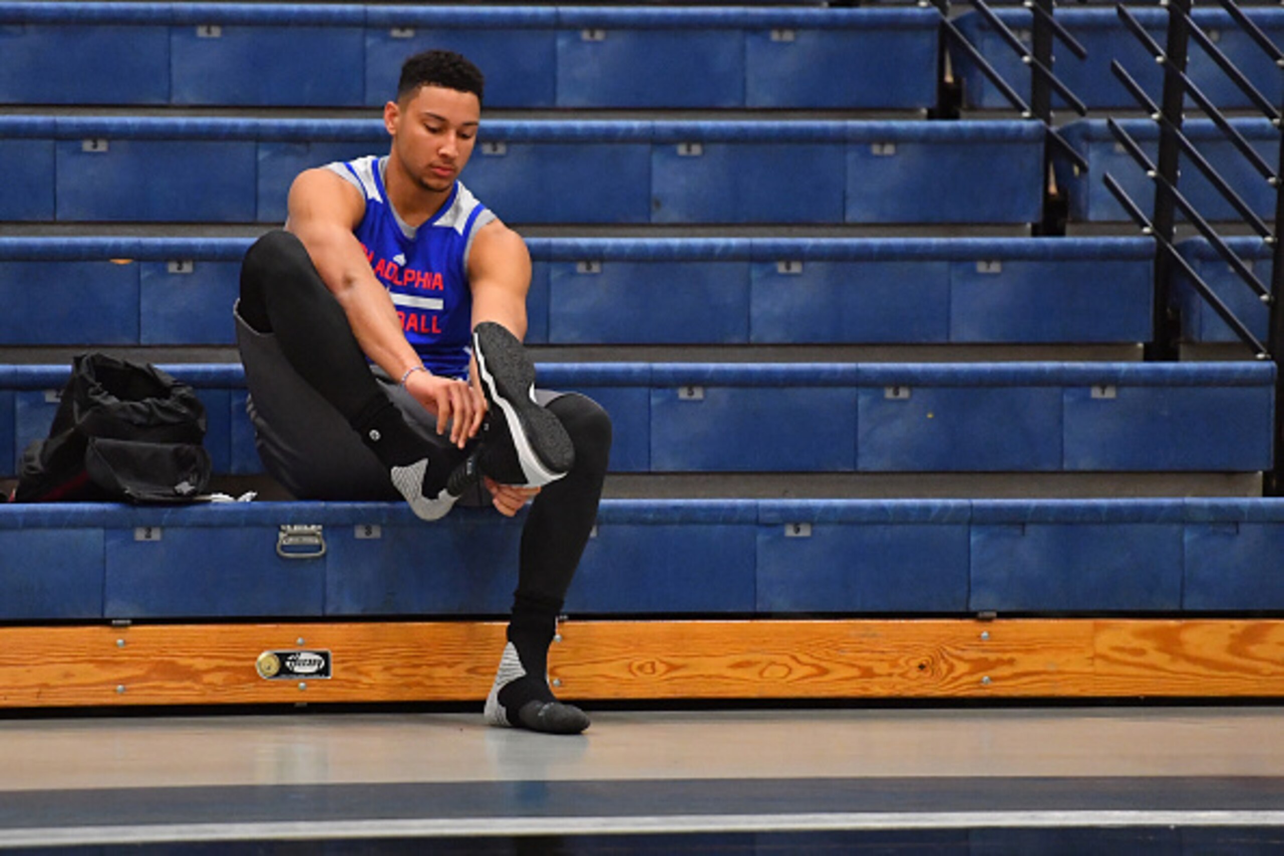 STOCKTON, NJ - SEPTEMBER 27:  Ben Simmons #25 of the Philadelphia 76ers puts his shoes on before practice at Stockton University on September 27, 2016 in Camden, New Jersey. NOTE TO USER: User expressly acknowledges and agrees that, by downloading and/or 