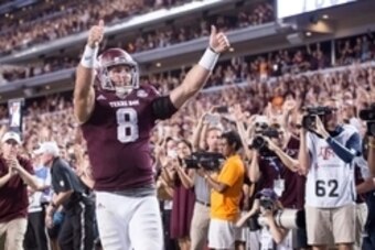 Oct 8, 2016; College Station, TX, USA; Texas A&M Aggies quarterback Trevor Knight (8) scores the winning touchdown against the Tennessee Volunteers during the game at Kyle Field. The Aggies defeat the Volunteers 45-38 in overtime. Mandatory Credit: Jerome