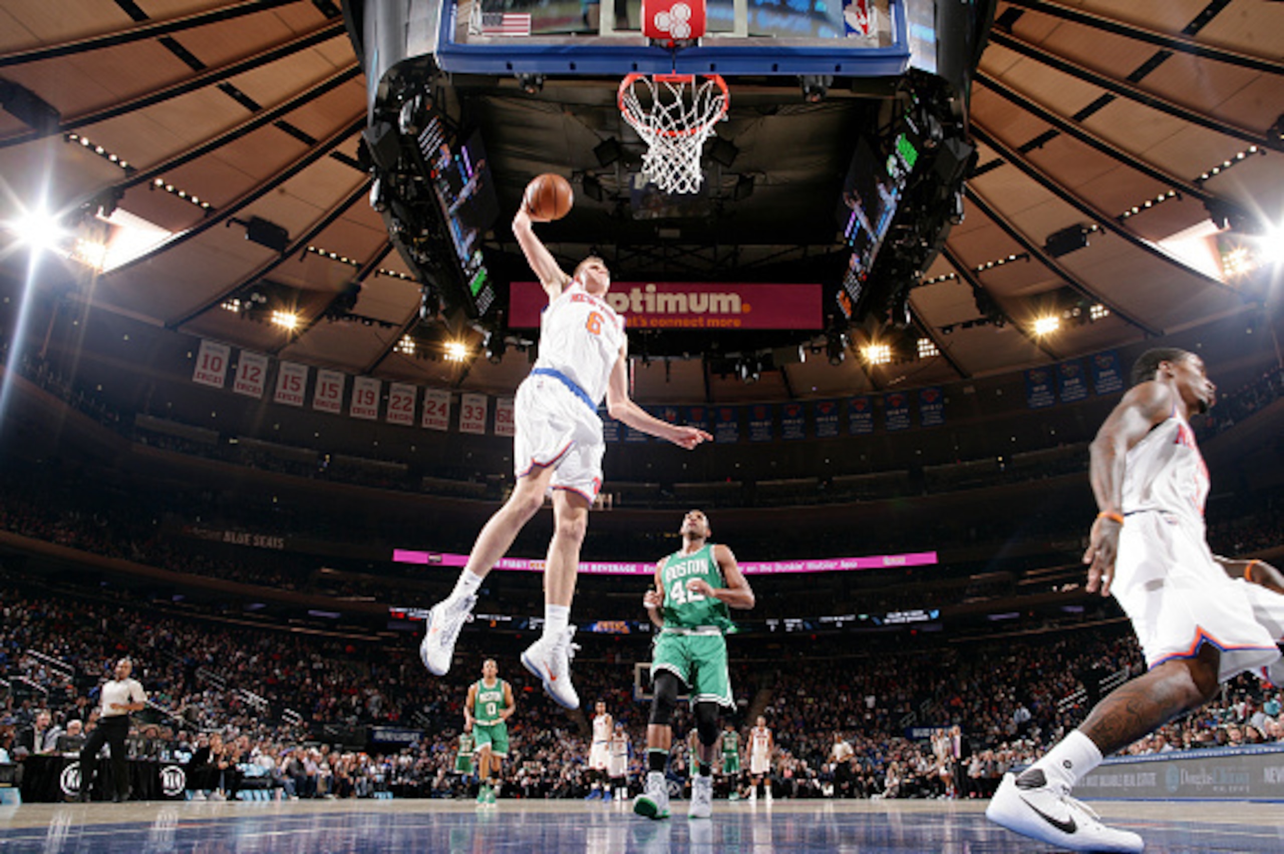 NEW YORK, NY - OCTOBER 15: Kristaps Porzingis #6 of the New York Knicks goes for a dunk against the Boston Celtics on October 15, 2016 at Madison Square Garden in New York City, New York.  NOTE TO USER: User expressly acknowledges and agrees that, by down