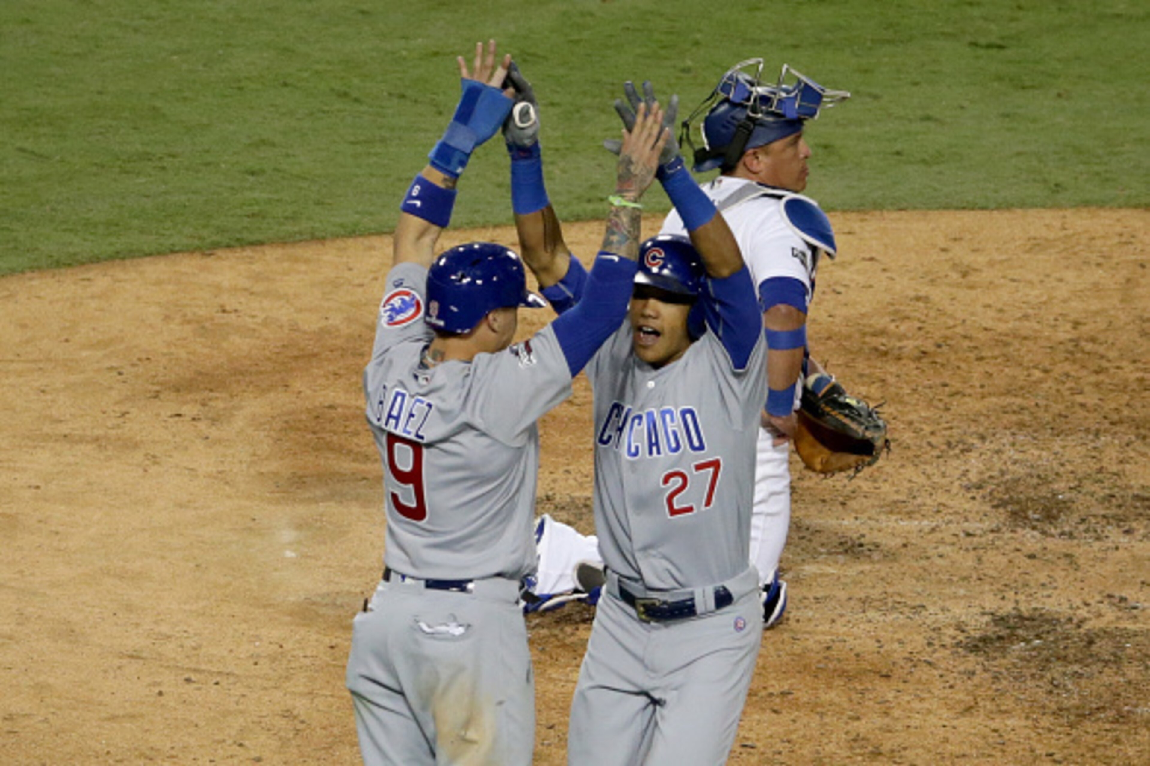 LOS ANGELES, CA - OCTOBER 20: Javier Baez #9 and Addison Russell #27 of the Chicago Cubs celebrate after a two-run home run in the sixth inning against the Los Angeles Dodgers in game five of the National League Division Series at Dodger Stadium on Octobe